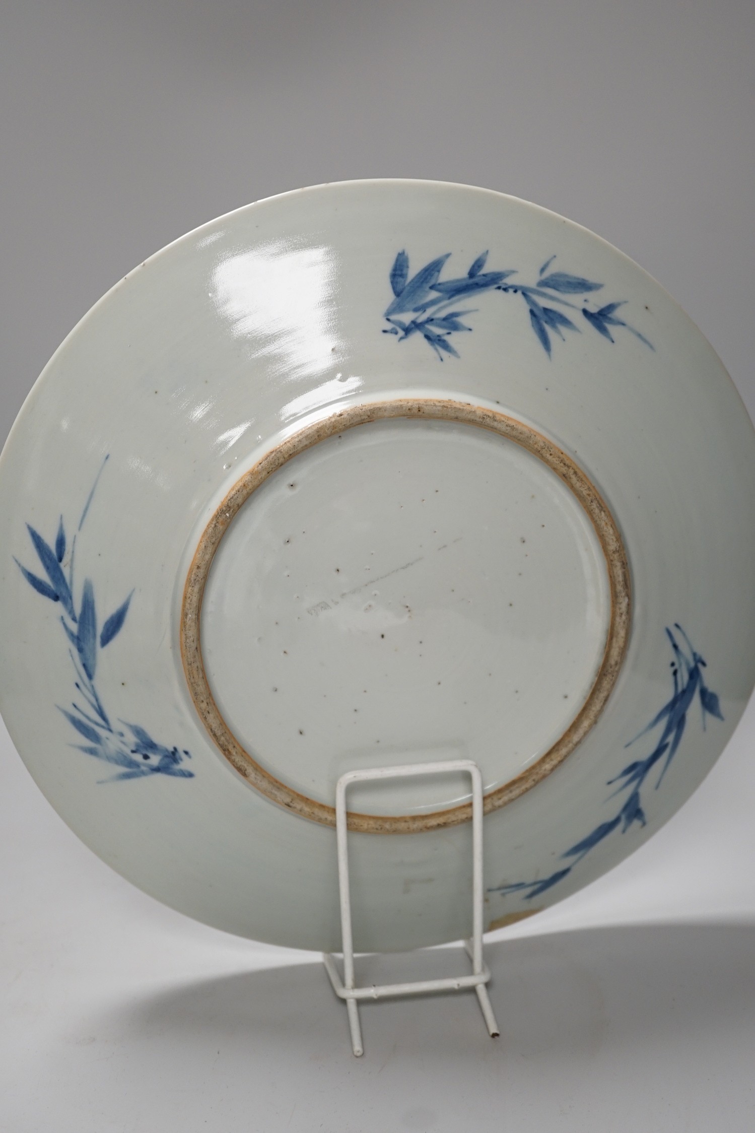 A Chinese blue and white ‘lotus’ charger, together with a bowl and dragon pot on tripod base
